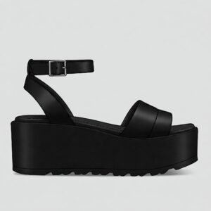 Minimalist black flatform sandals with a thick sole and ankle strap buckle closure. 