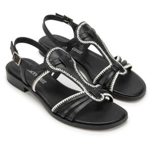 Stylish black and white sandals for women, showcasing a modern design.