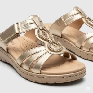 Comfortable gold designer sandals with cushioned soles, blending high fashion with wearable comfort.