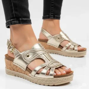Fashionable gold wedge designer sandals, providing a comfortable lift and a glamorous touch to any outfit.