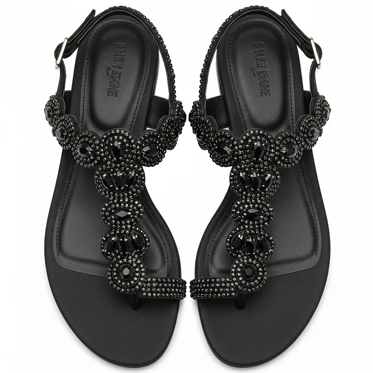 Overhead view of stunning black rhinestone sandals, revealing their full design and sparkling embellishments.
