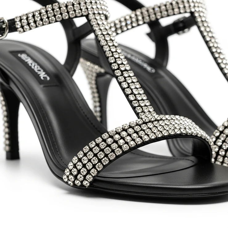 Elegant black sandals adorned with sparkling rhinestones, perfect for a night out or special occasion.