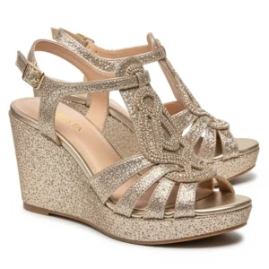 Sparkly gold metallic wedge sandals, perfect for adding a touch of glamour and shine to any festive outfit.